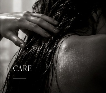 Hand running through wet hair